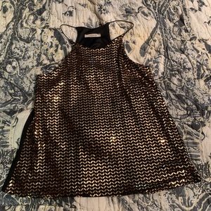 Beautiful Sequin top.  Front is gold sequin, back is solid black. Never worn
